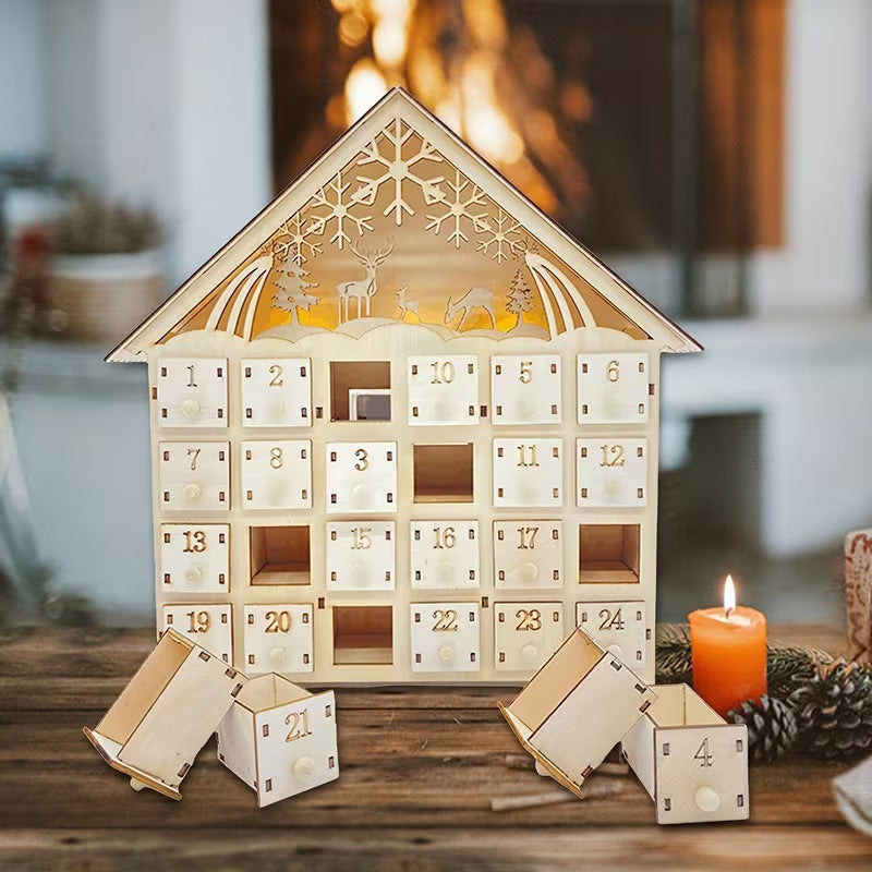 Illuminated wooden Advent calendar in cabin design